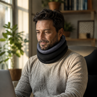 man with foam neck brace working in front of a computer
